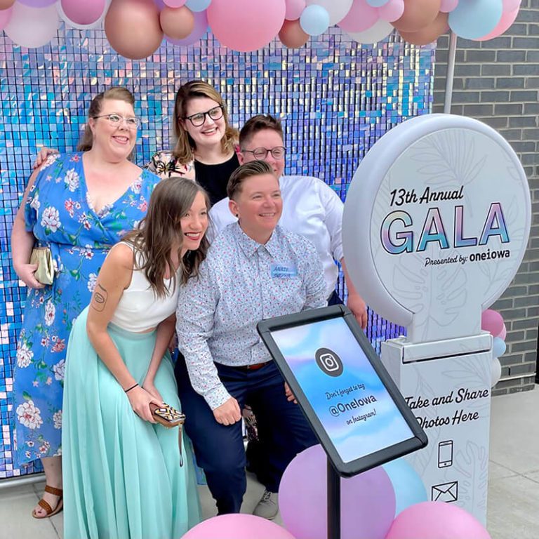 Guests at a fundraising gala using a snapXP photo booth