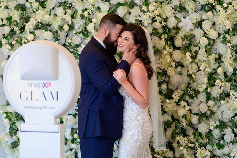 Wedding guests posing at a snapXP photo booth