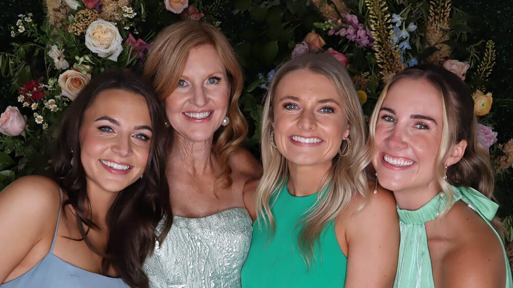 The same four guests photographed without the GLAM filter